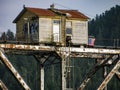 Wooden keepers station at top of historic railroad bridge